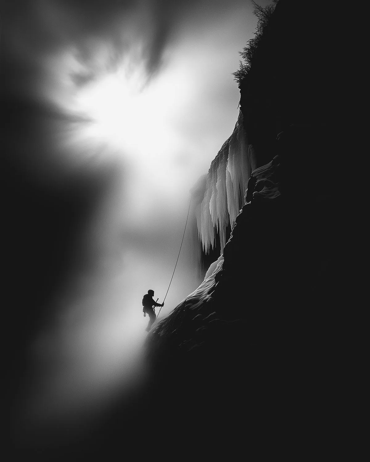 Climber on Icy Cliff