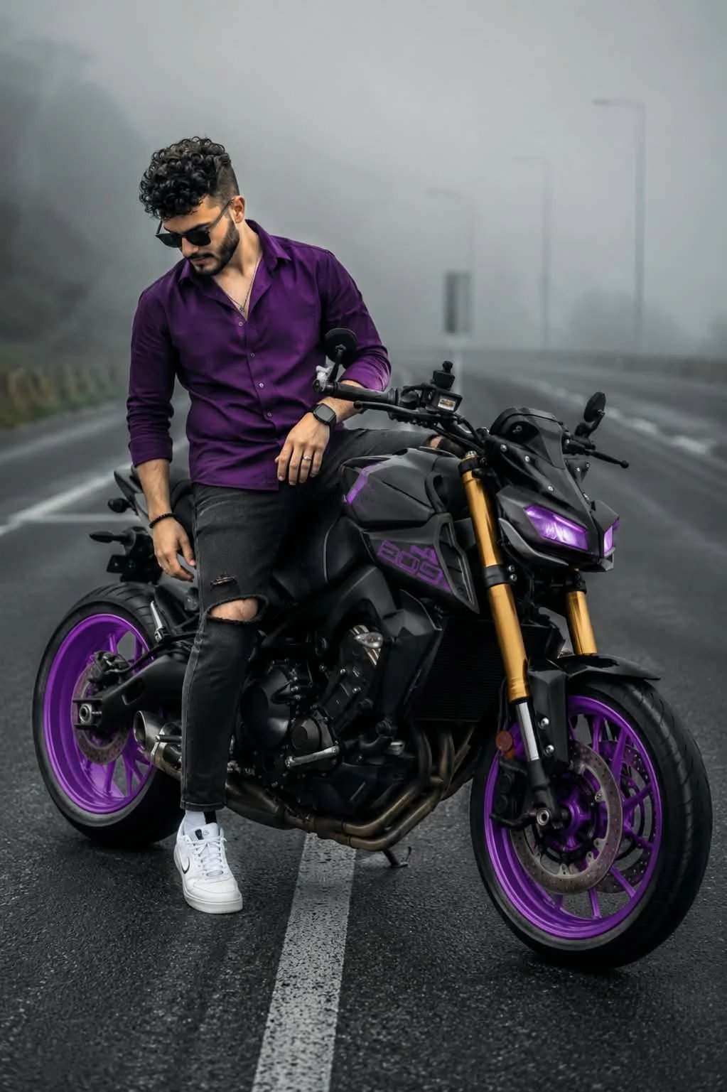 Motorcyclist on foggy road